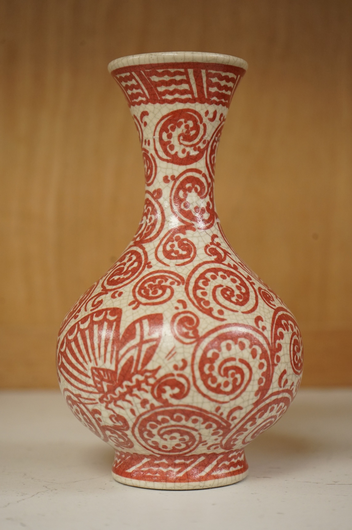 An unusual Delft red and white bottle vase, 16cm high
